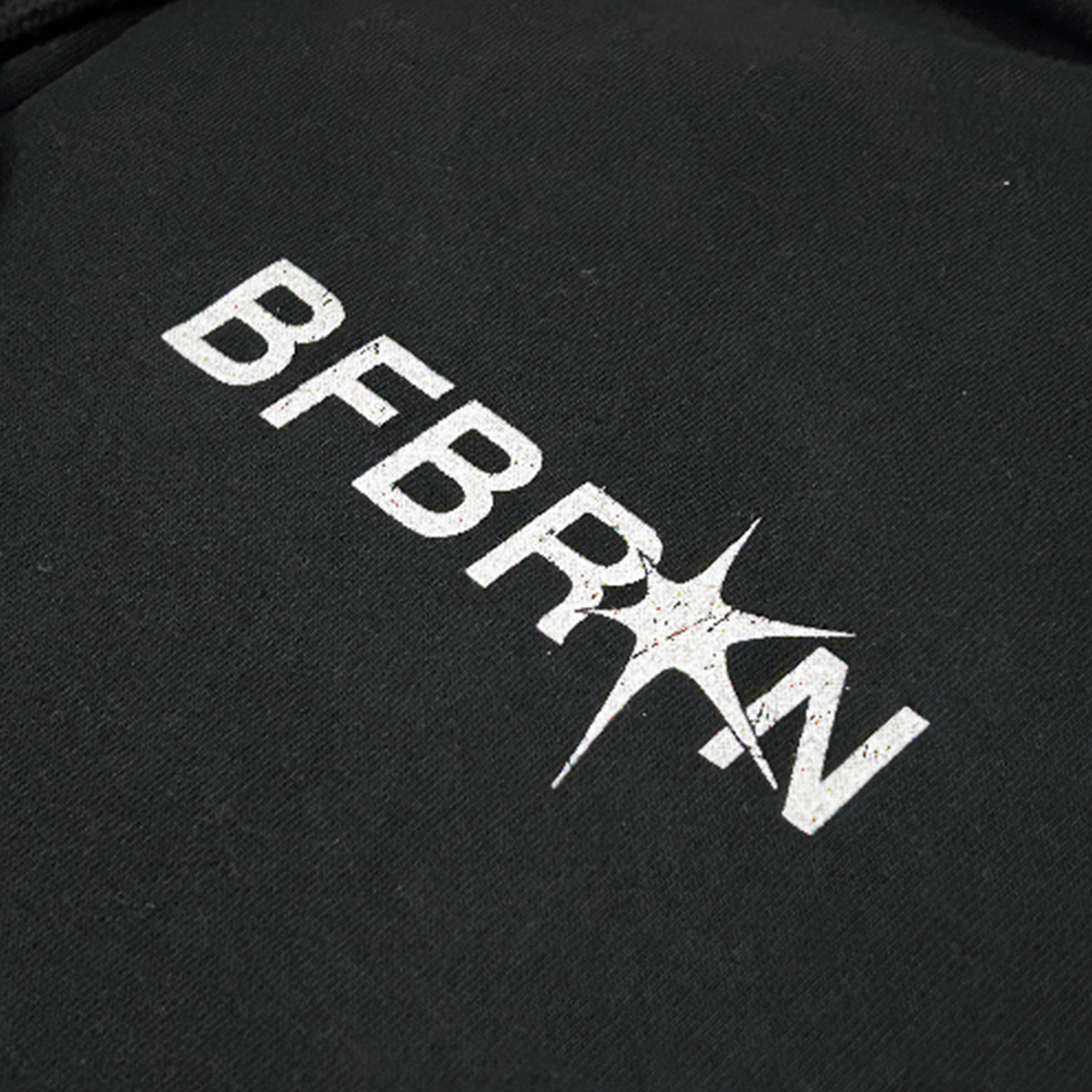 Close-up of the BFBRKN logo on a Prosper Zip-Up Hoodie (Black) design, showcasing the branding detail.